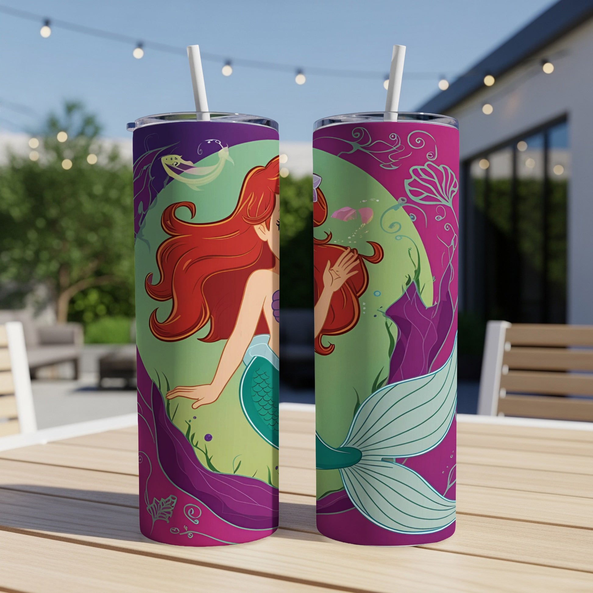 Two tumblers with a colorful mermaid design and underwater foliage.