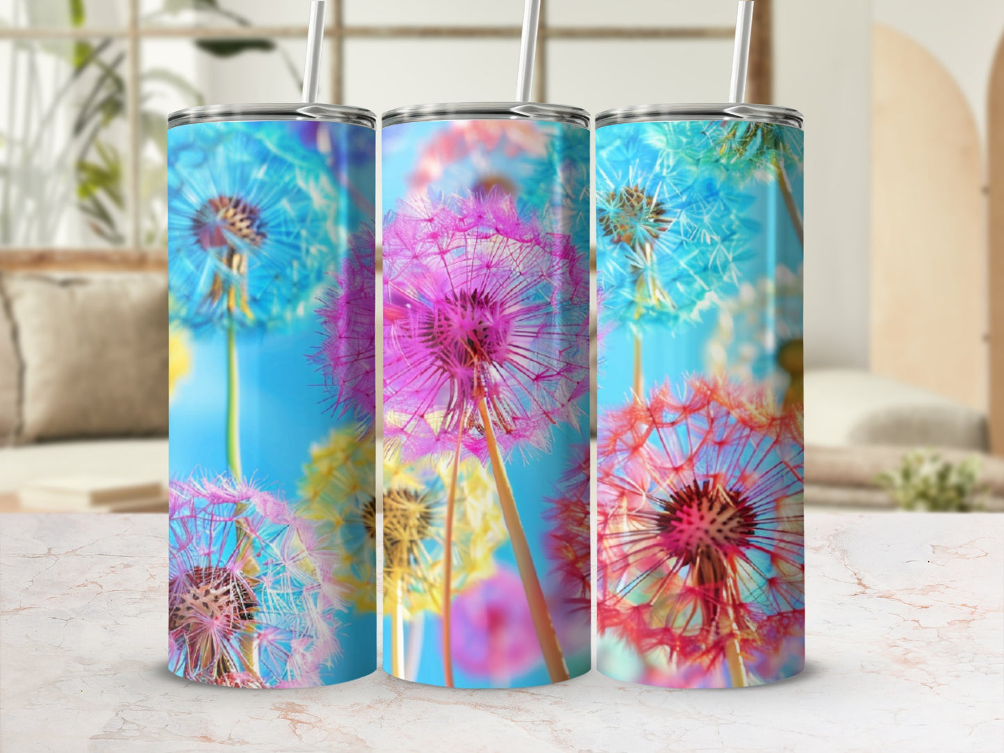 Three tumblers featuring colorful dandelion seeds against a bright blue background.
