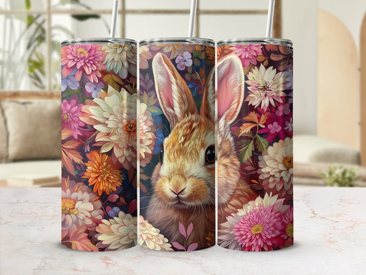 Bunny surrounded by a colorful floral pattern on a tumbler.