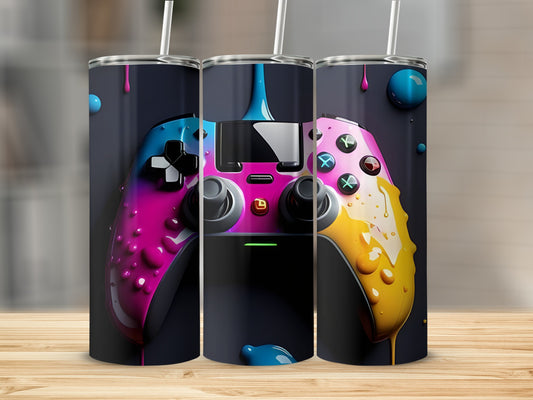 Pink and blue video game controller with dripping paint, on a wooden surface.