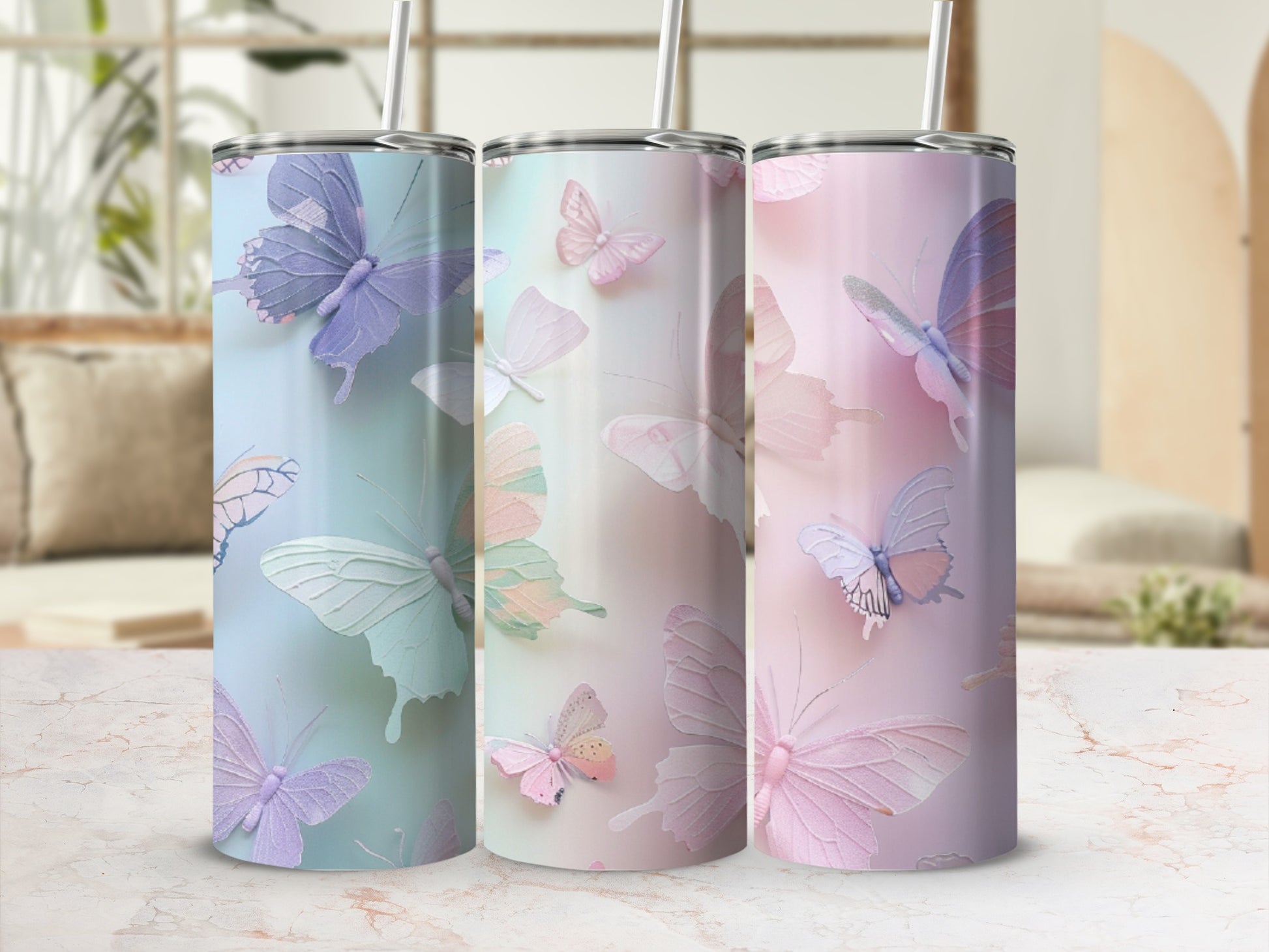 Three pastel tumblers with delicate butterfly designs.