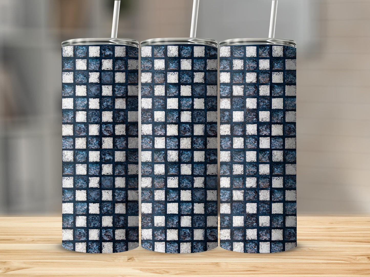 Three tall tumblers with a blue and white tiled mosaic pattern, each with a straw.