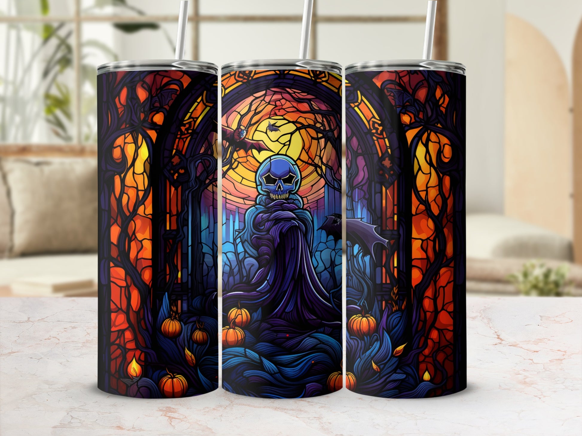 Three tumblers featuring a spooky stained-glass Halloween scene with a skull.