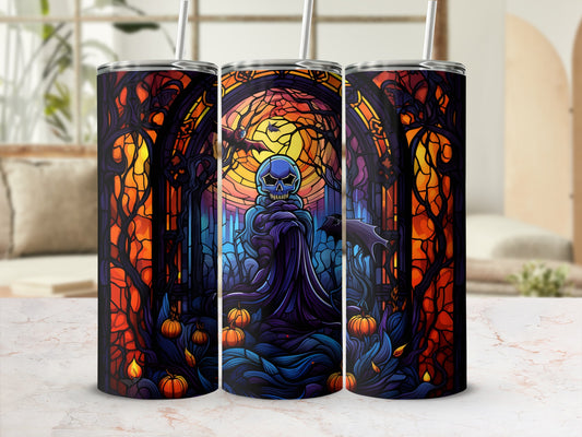 Three tumblers featuring a spooky stained-glass Halloween scene with a skull.