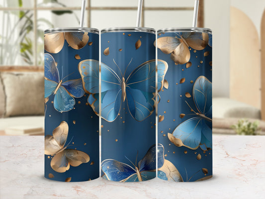 Blue and gold butterflies on a dark blue tumbler with a marble background.