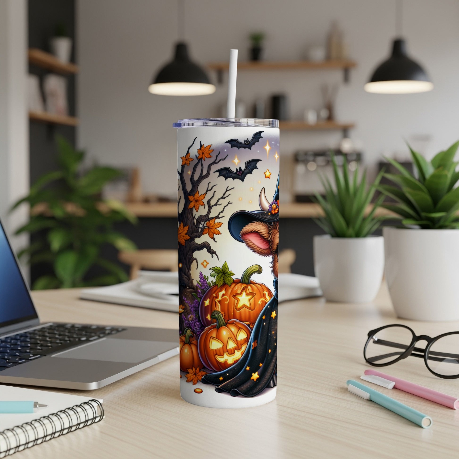 Halloween-themed tumbler with a cow in a witch hat and bats.