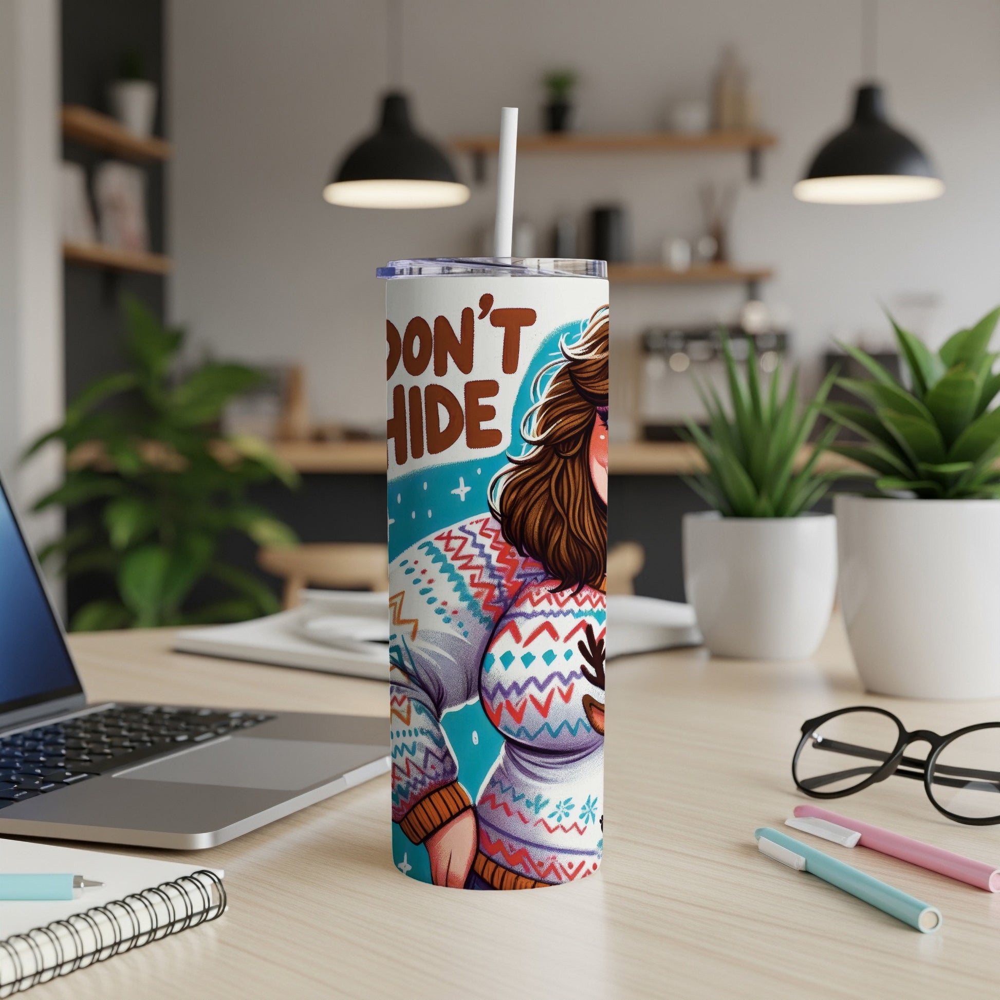 Woman in patterned sweater with "DON'T HIDE" text on a tumbler.
