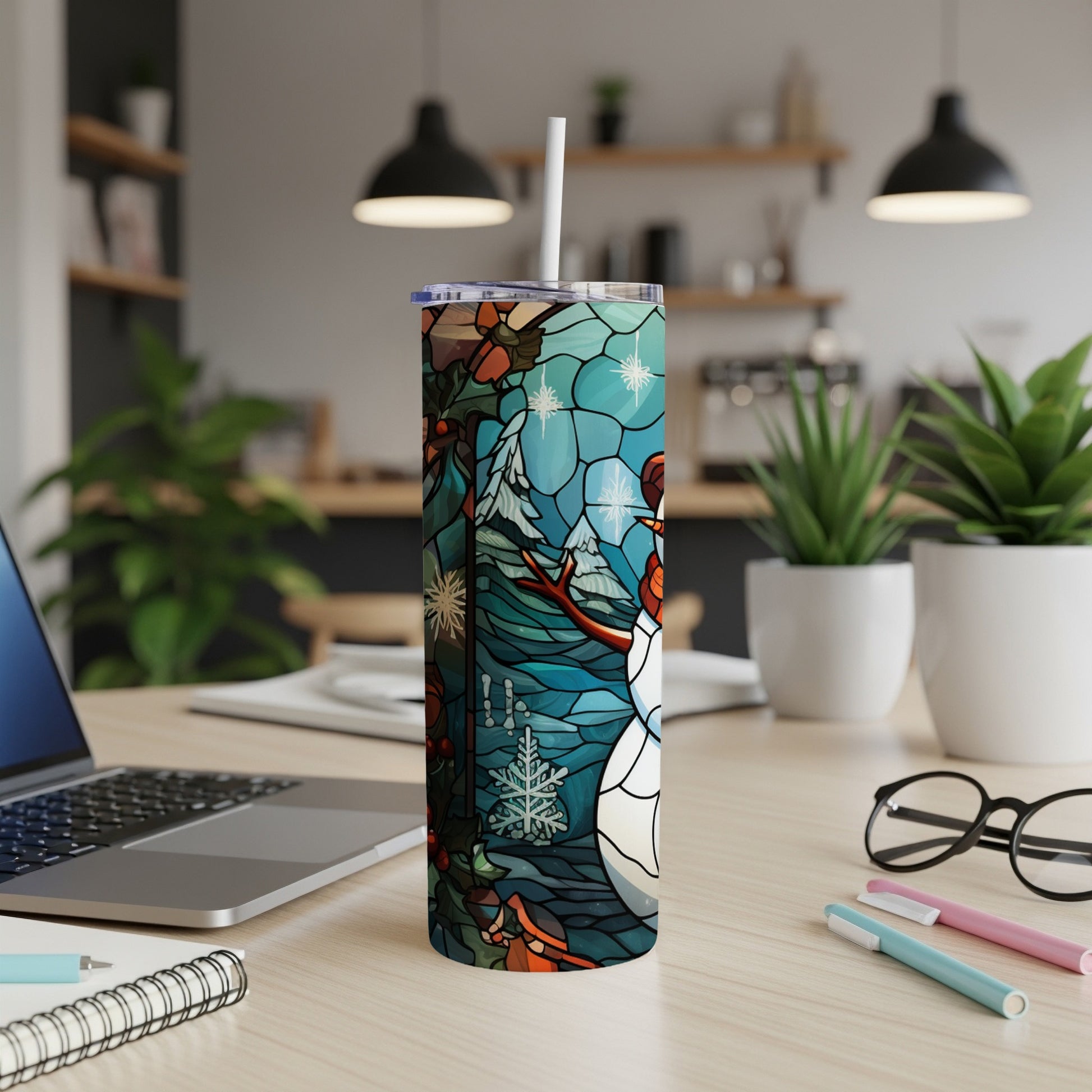 Snowman stained glass design on a white skinny tumbler with a straw.