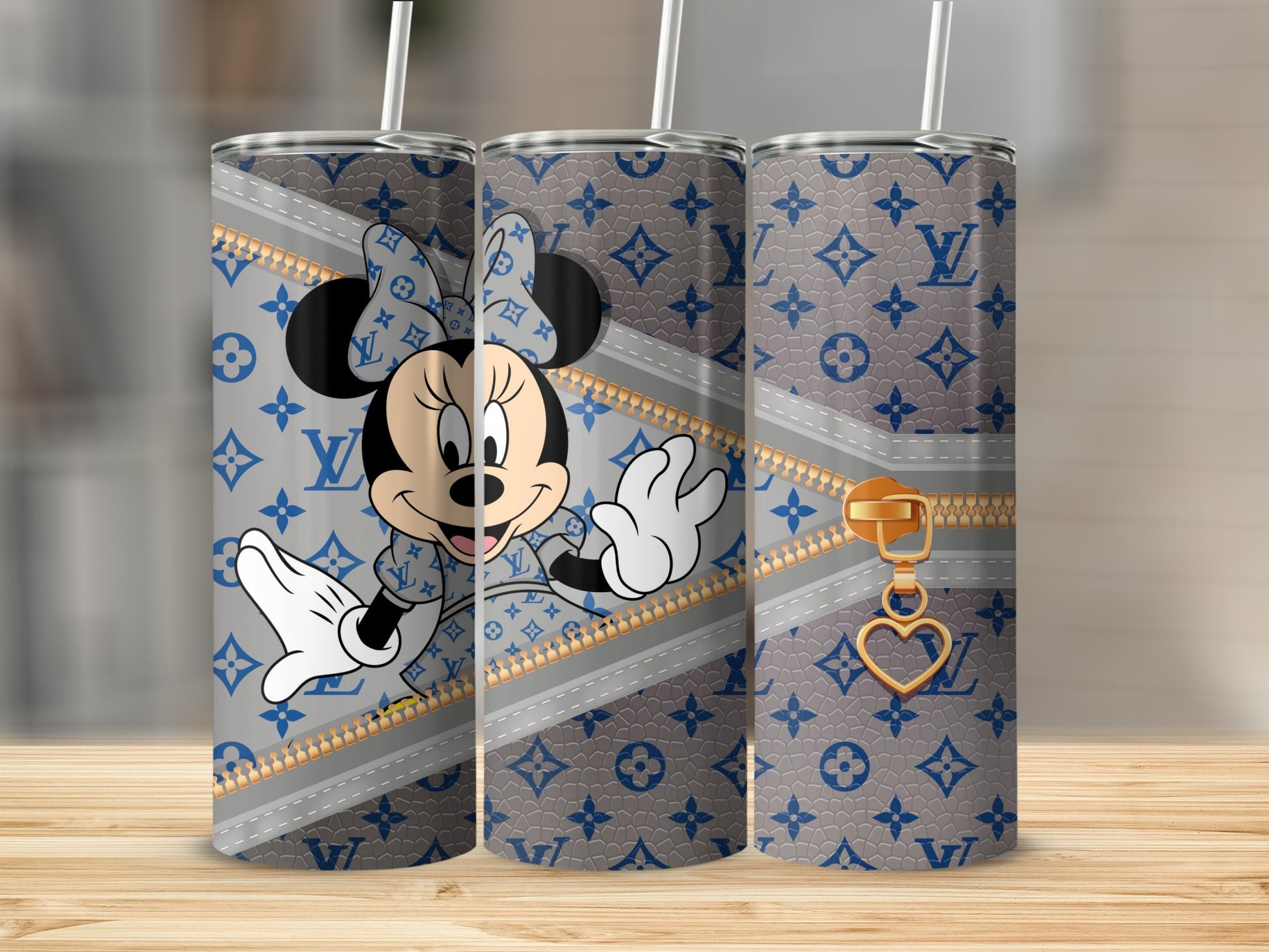 Minnie Mouse in Louis Vuitton print on a tapered tumbler with gold zipper detail.
