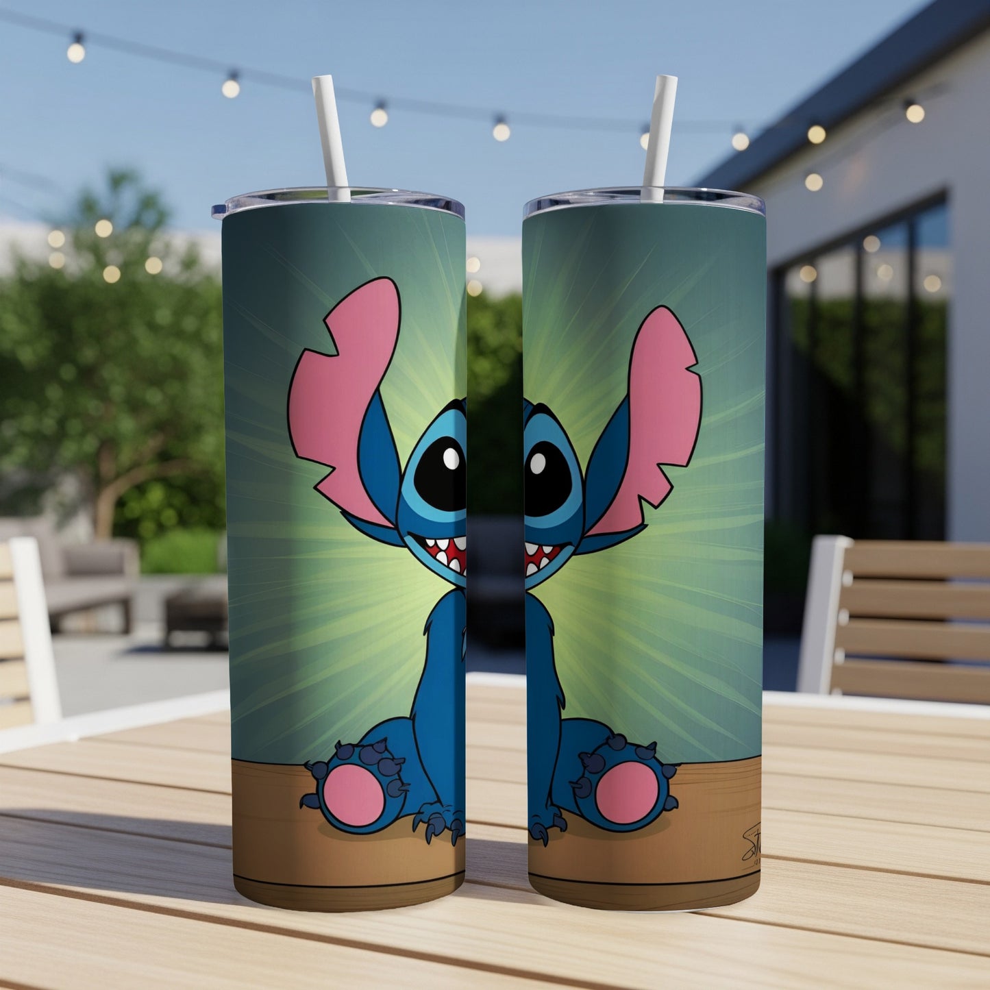 Two blue Stitch character tumblers with straws on a wooden table.