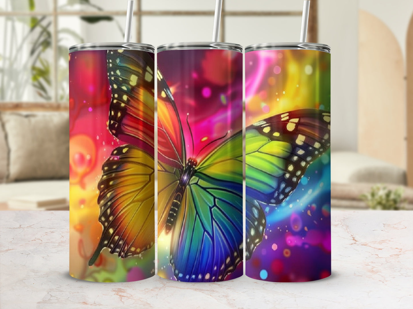 Three stainless steel tumblers with vibrant, iridescent butterfly designs.