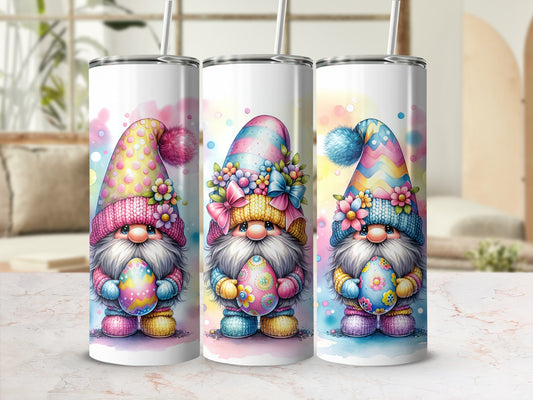 Three Easter gnomes holding decorated eggs against a blurred background.