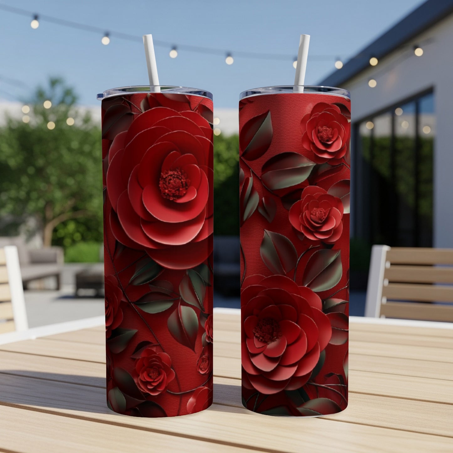 Two tall red tumblers with layered red rose floral patterns.