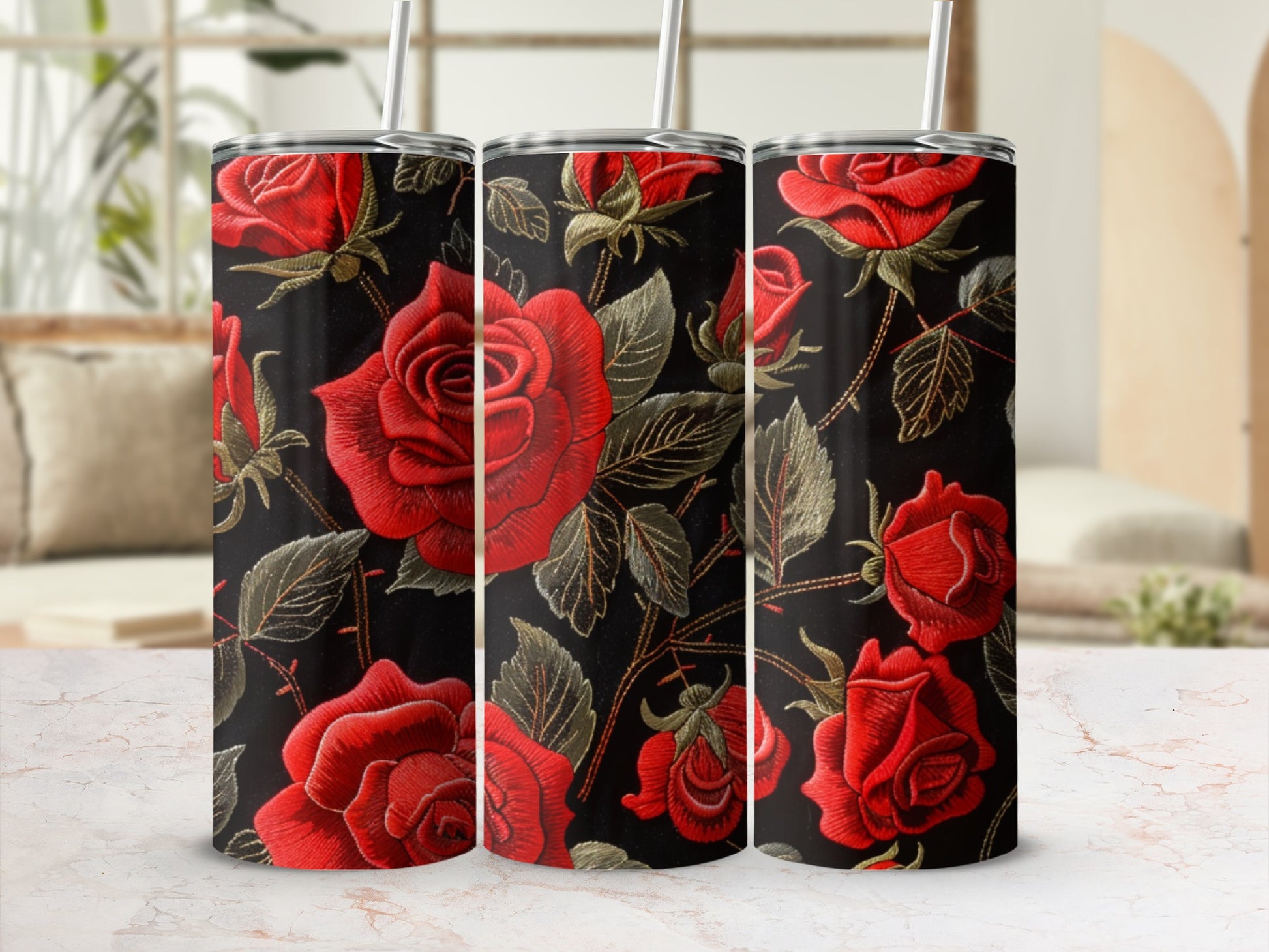 Black tumbler with embroidered red roses and green leaves pattern.