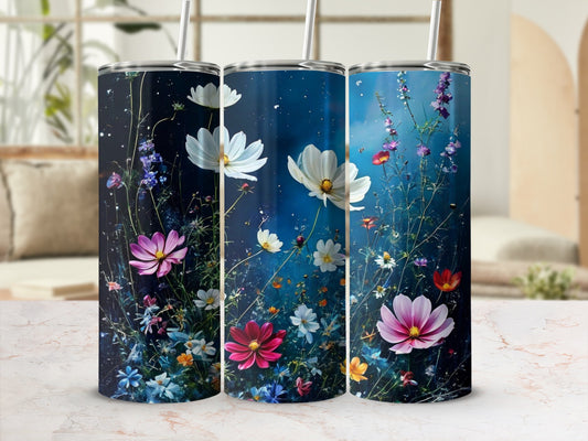 Three tumblers with a floral design on a blurred background.