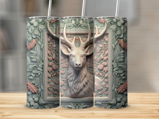 Deer head in ornate frame on a patterned tumbler.