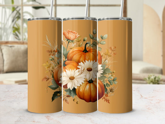 Three orange tumblers with a pumpkin and floral design.