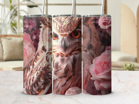 Close-up of an owl's face with pink roses on a tumbler.