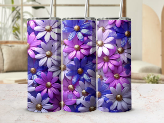 Three tumblers with a floral pattern in purple, blue, and white.