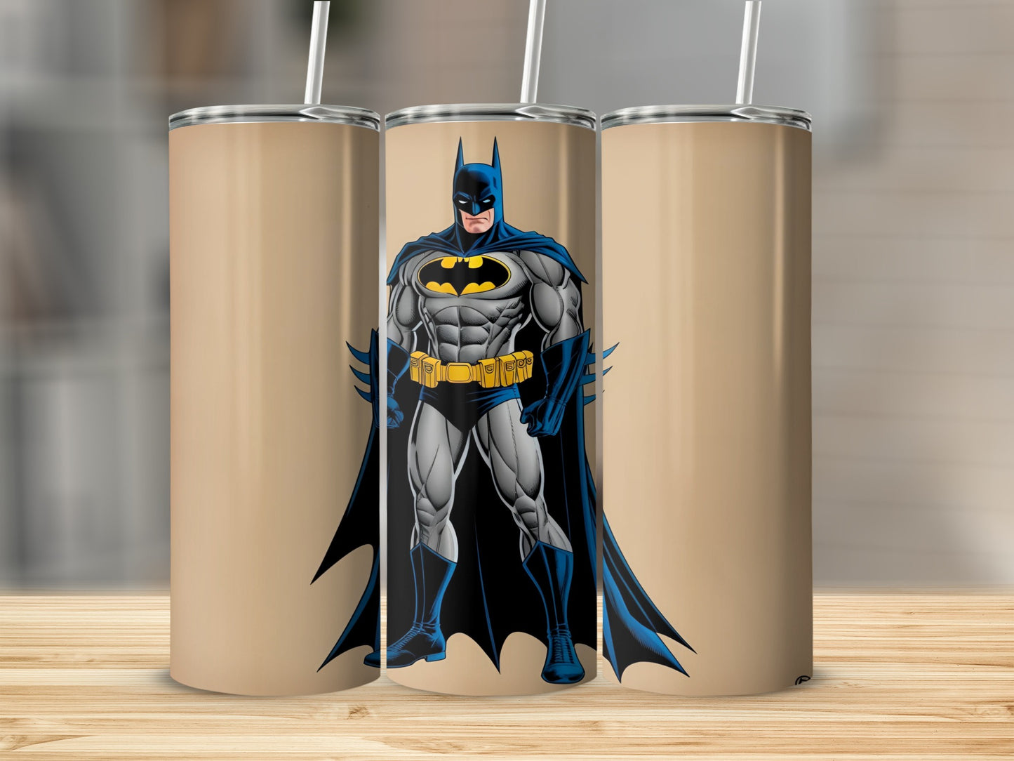 Batman standing heroically against a tan background, three tumblers shown.