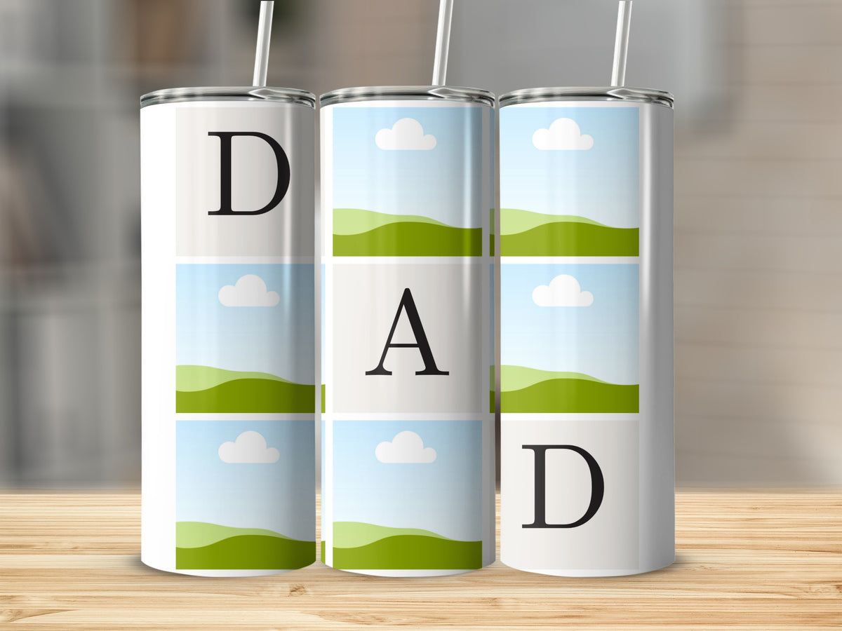 Three white tumblers with the letters D A D and landscape images.