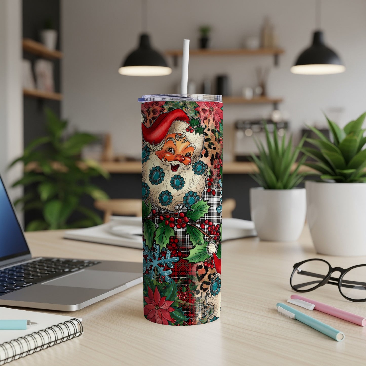 Santa Claus tumbler with plaid, floral, and snowflake pattern.