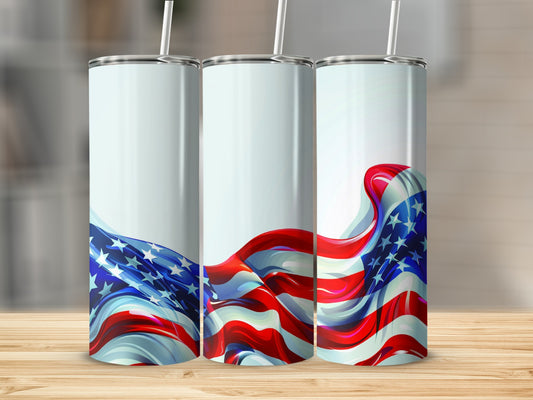 Three tumblers with a flowing American flag design on a wooden surface.