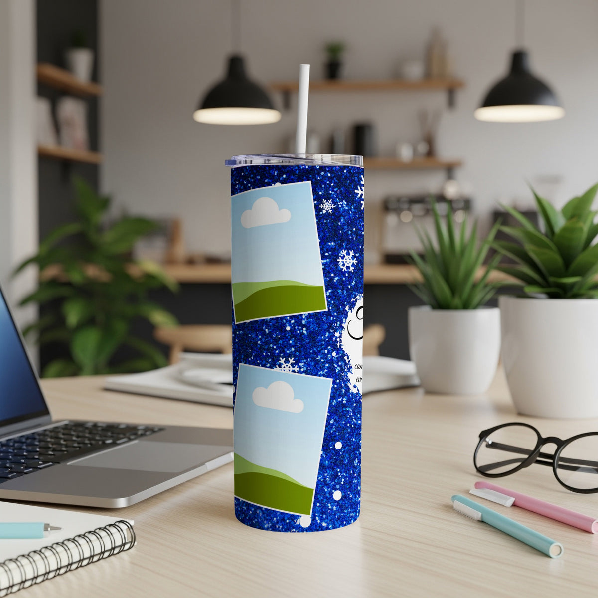 Glittering blue tumbler with snowflake design and two photo frames.