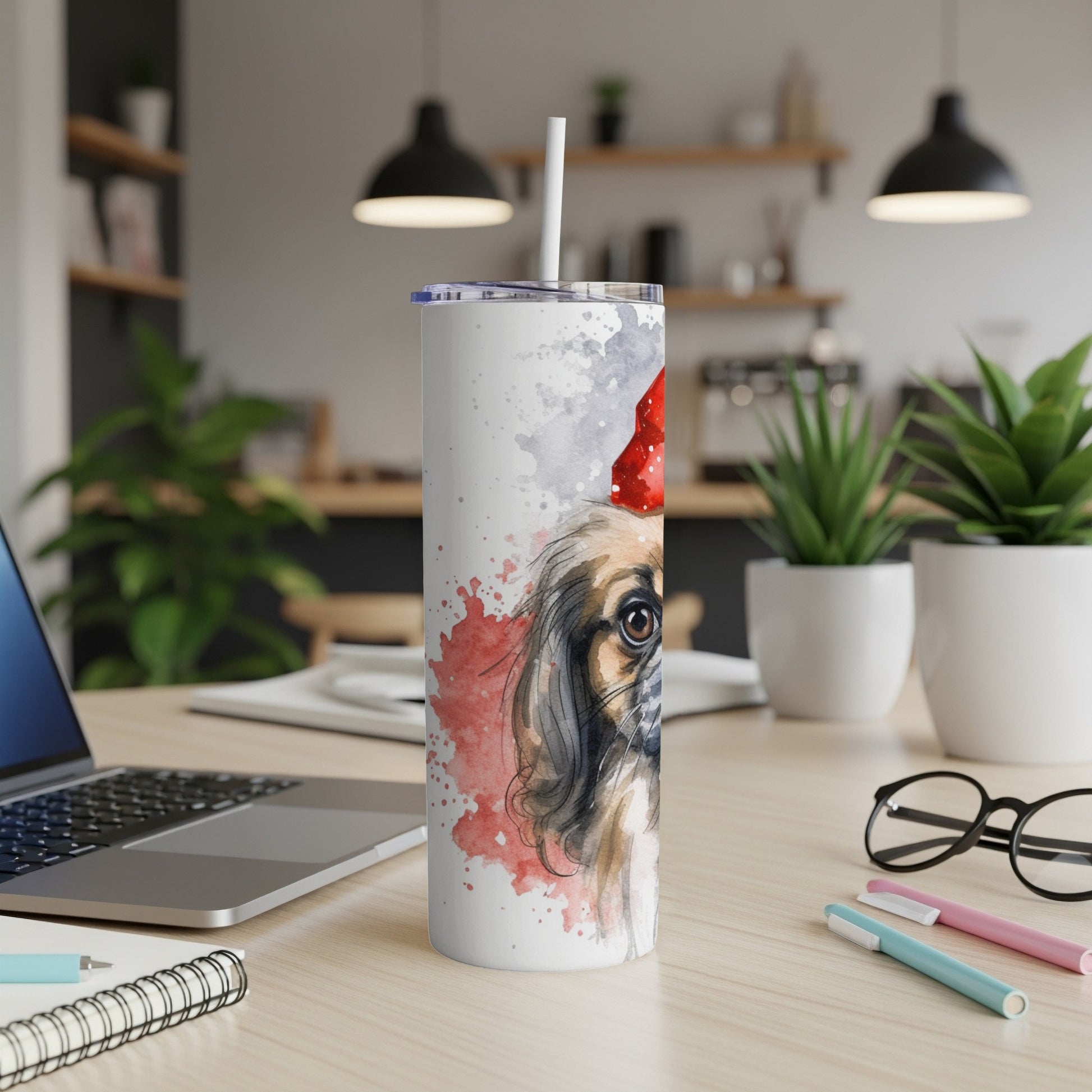 Watercolor painting of a Pekingese dog wearing a Santa hat on a white tumbler.