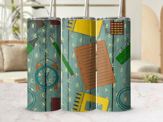Three tumblers with a school-themed pattern of letters, rulers, and a clock.