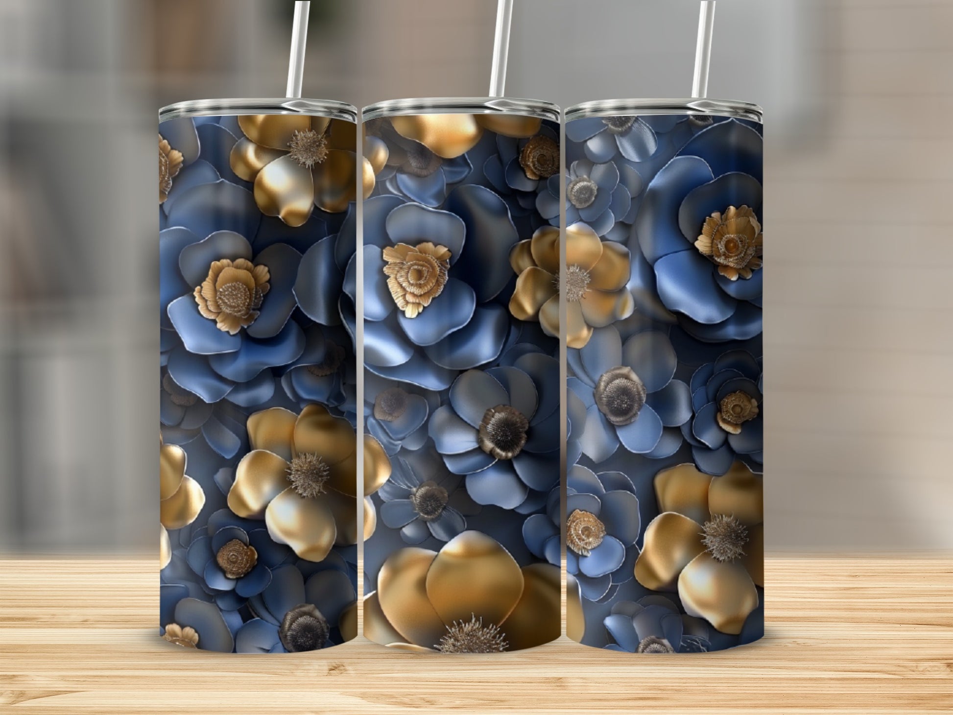Triptych of tumblers with navy blue and gold floral pattern.