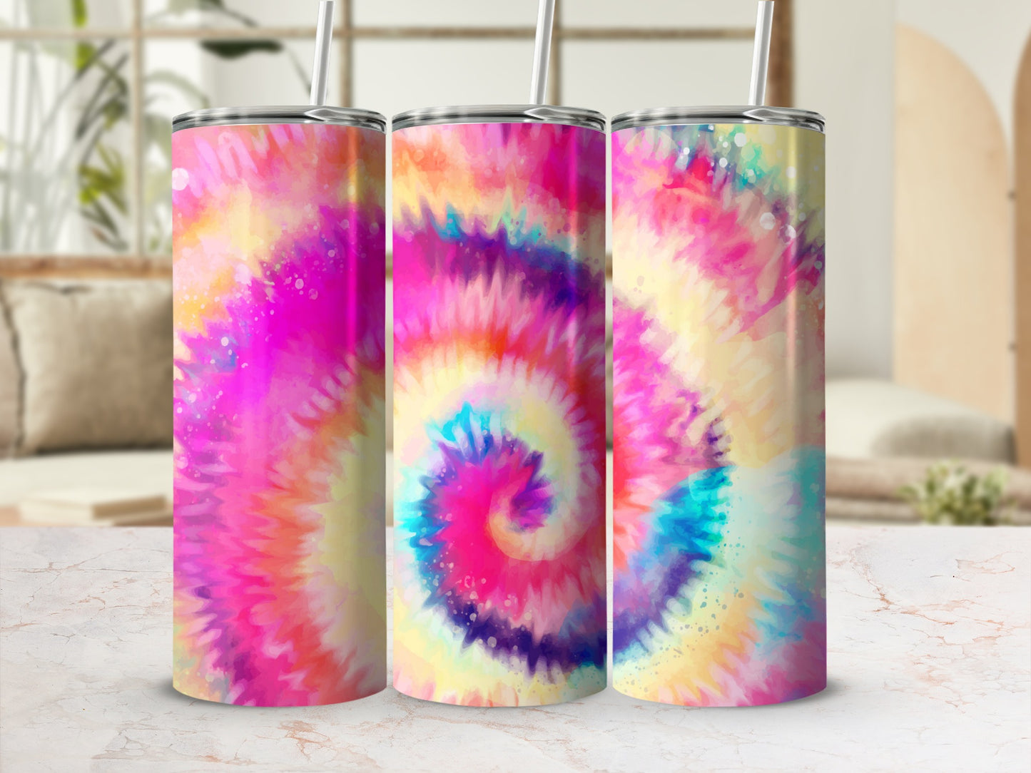 Three tumblers with colorful tie-dye patterns and straws.
