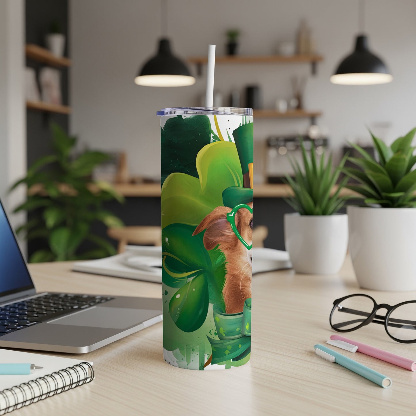 Golden retriever wearing a green hat and glasses on a St. Patrick's Day tumbler.