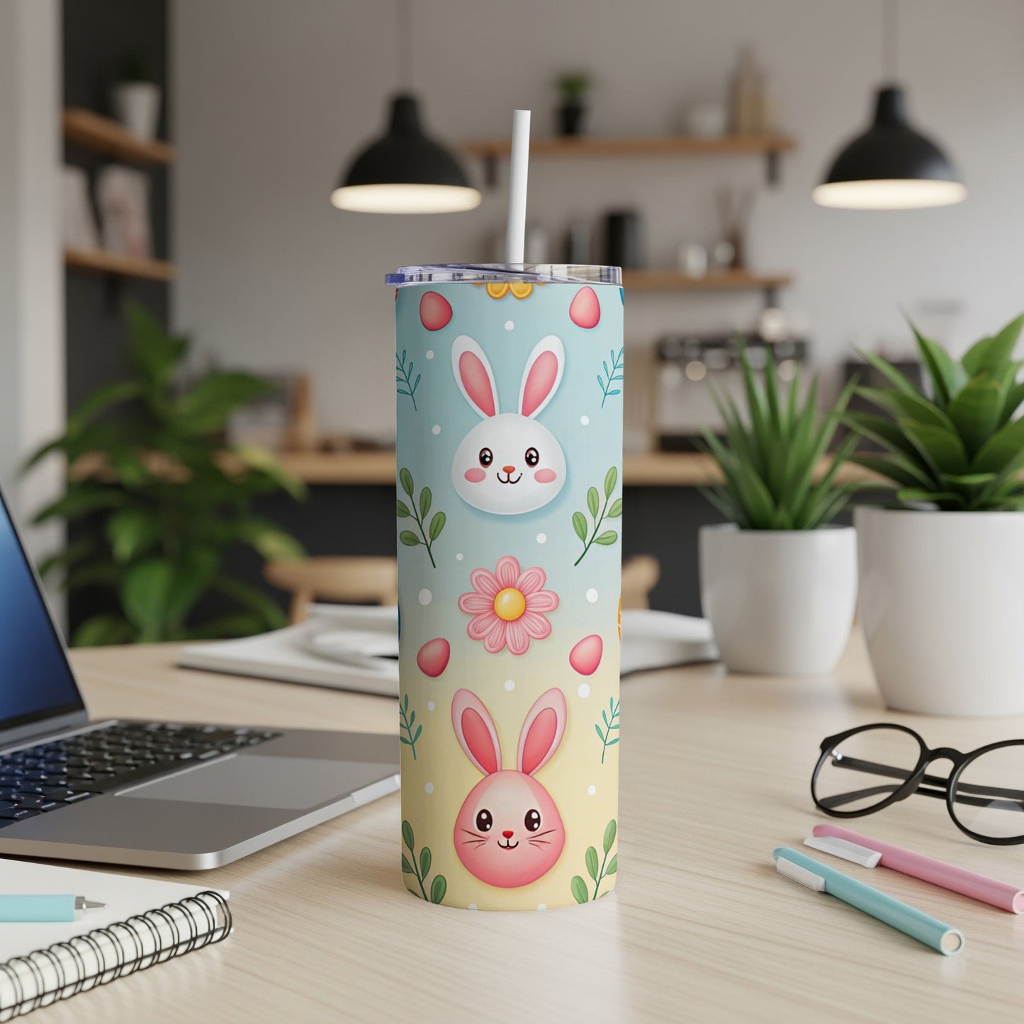 Easter bunny tumbler with pink and blue design and straw.