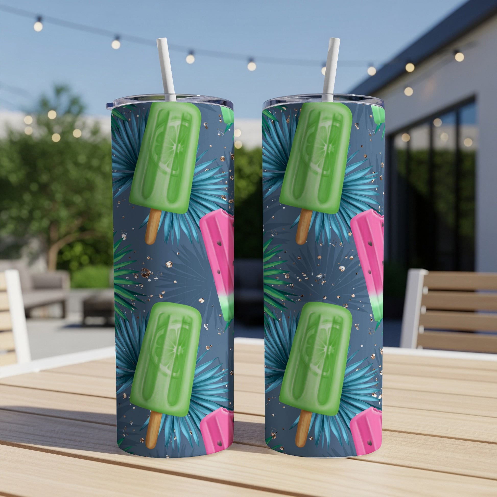 Two tumblers with lime popsicle and palm leaf pattern.