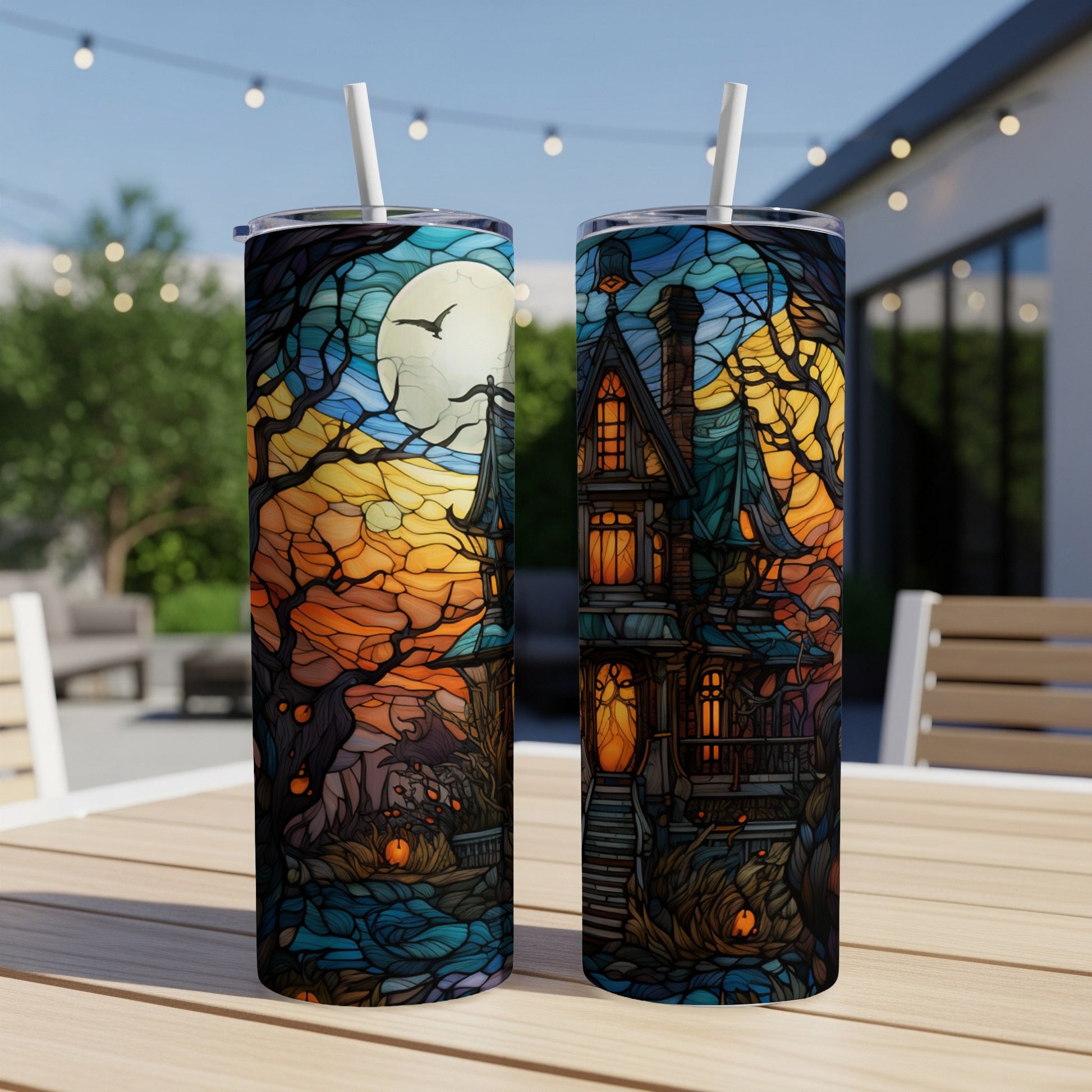 Two tumblers with a spooky stained-glass haunted house and moon design.