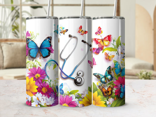 Tumbler with butterflies, flowers, and a stethoscope design.