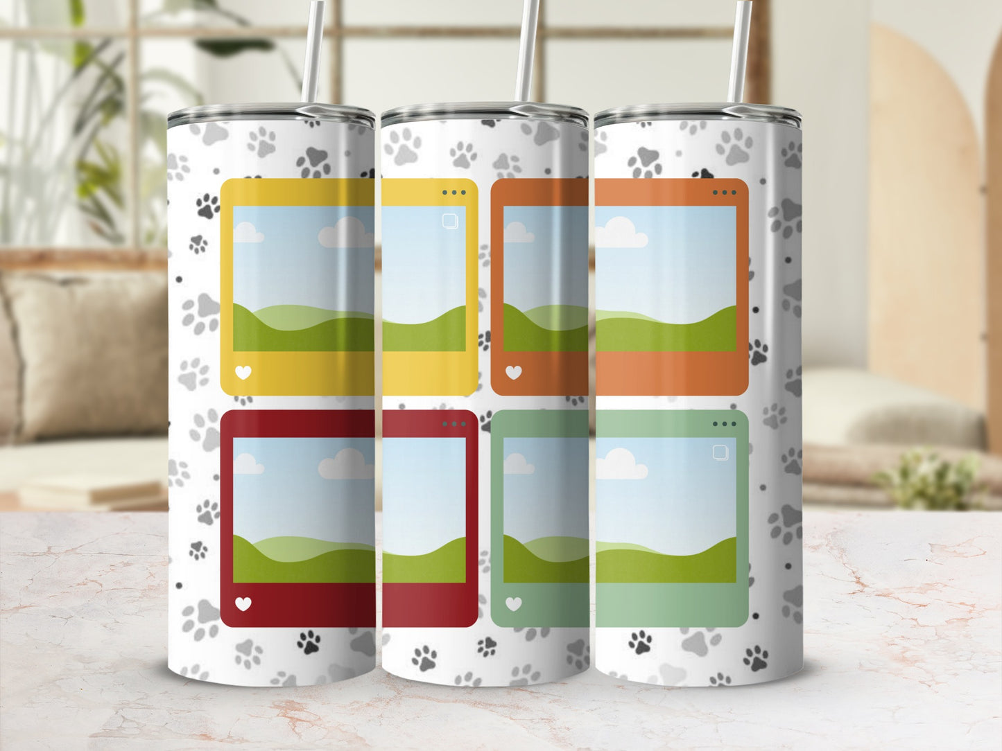 Tumblers with paw print pattern and colorful picture frames on white background.