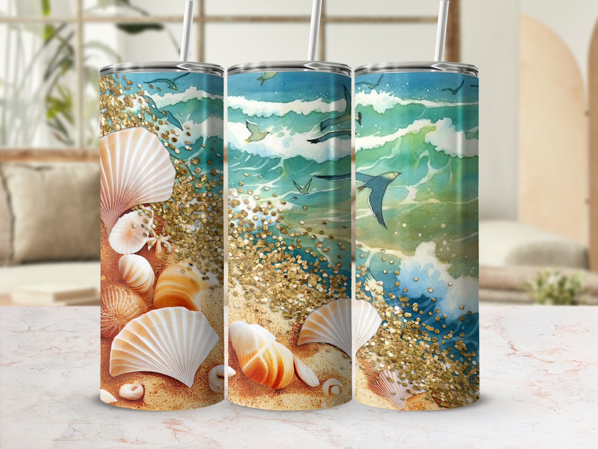 Three beach-themed tumblers with seashells, waves, and seagulls against a sandy background.