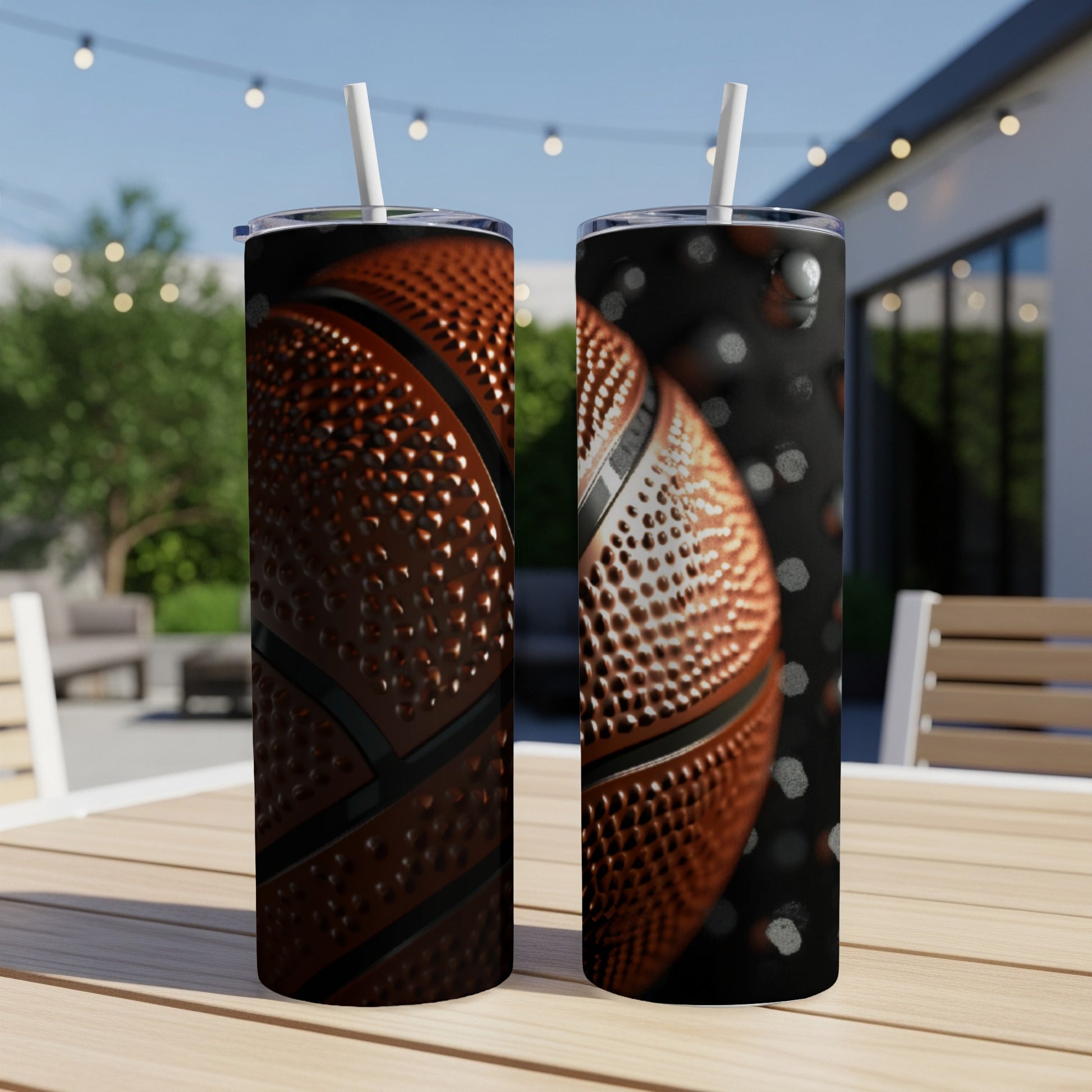Two tumblers with a basketball design on a wooden table.