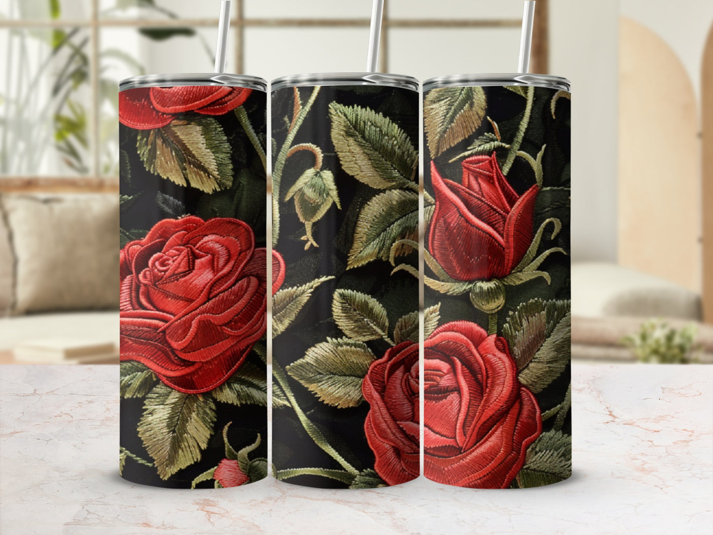 Three tumblers featuring a dark background with embroidered red roses and green leaves.