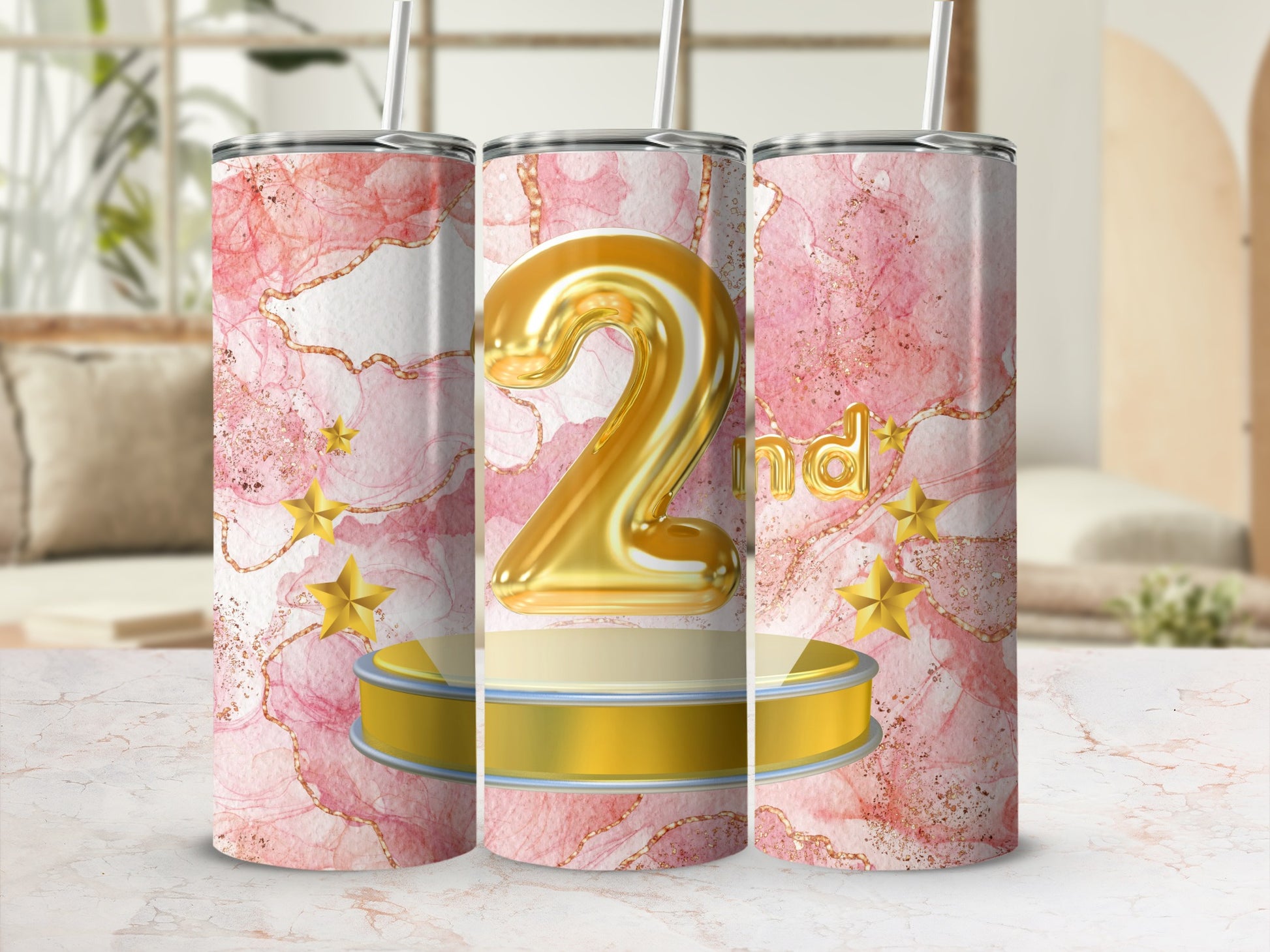 Gold number 2 on a pedestal with pink marble background and stars.