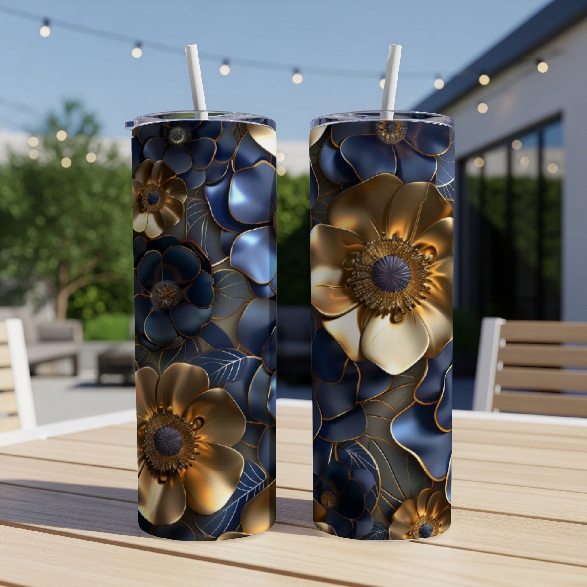 Two tall tumblers with a dark blue and gold floral design.