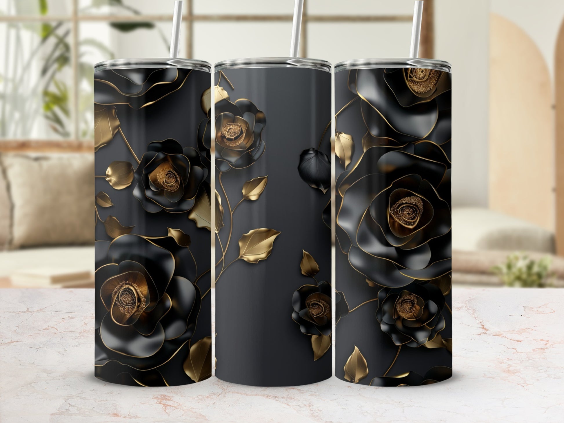 Three dark tumblers with intricate black and gold floral designs.