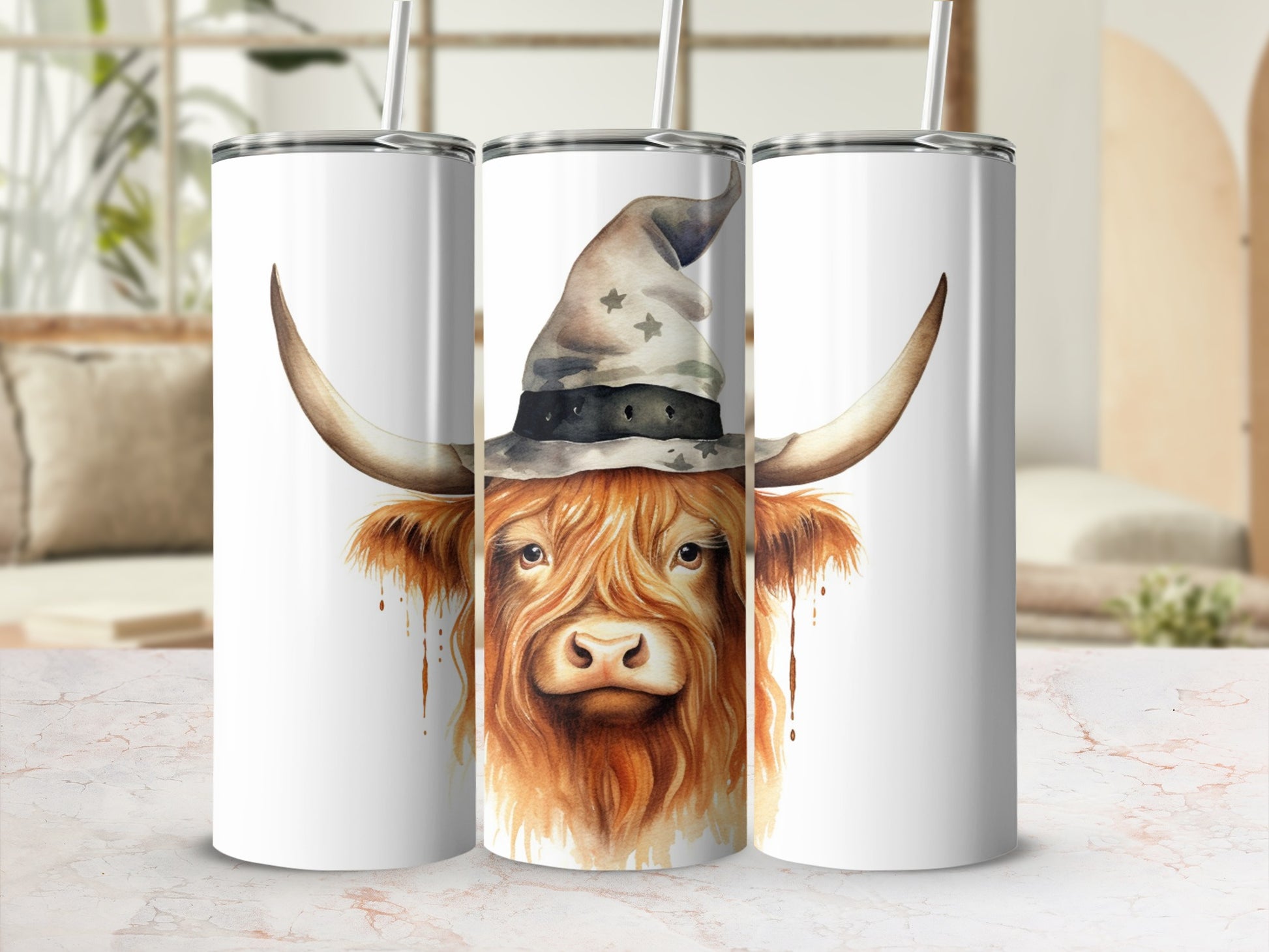 Highland cow wearing a witch hat on a white tumbler.