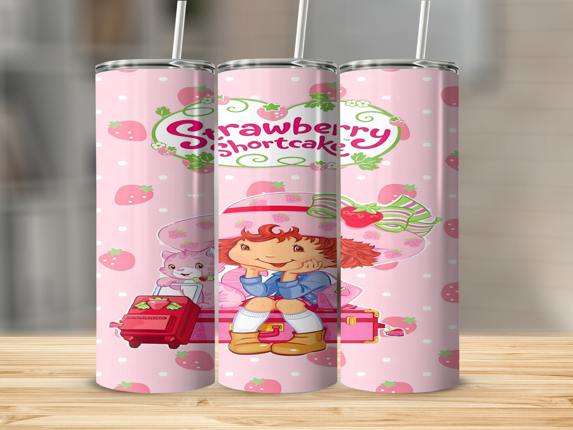 Strawberry Shortcake character with luggage and cat, on a pink background.