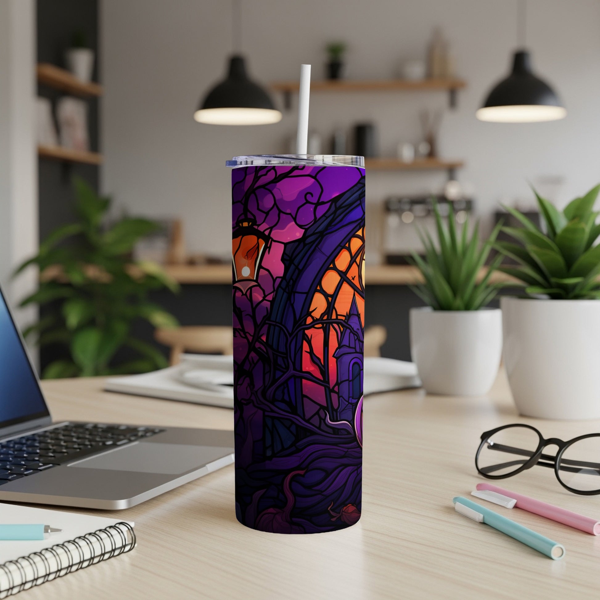 Purple Halloween tumbler with spooky house and moon design.
