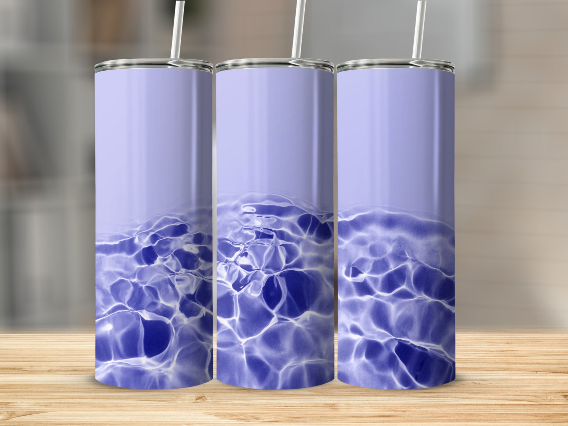 Three tall, purple tumblers with a water ripple design.