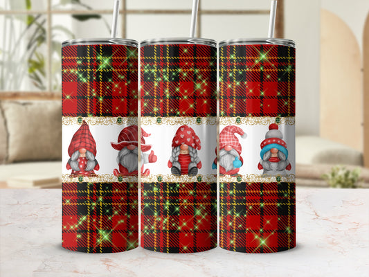 Three tumblers with red plaid and gnome designs, with a blurred background.
