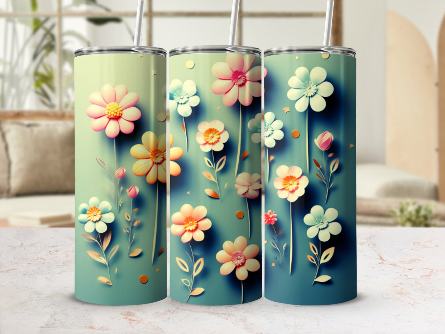 Three tumblers with pastel floral designs and straws.